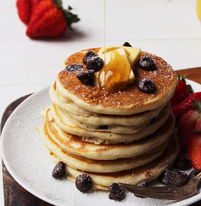 chocolate chip pancakes stack with butter and honey