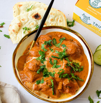 butter chicken with rice and naan bread