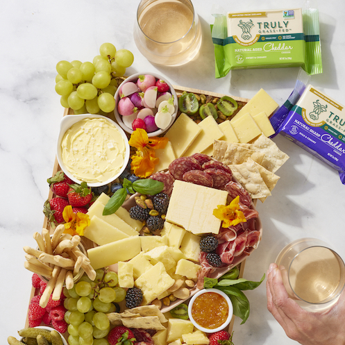 cheese board with buts and fruit